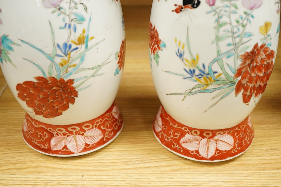 A pair of Japanese Kutani two handled vases, 41cm high